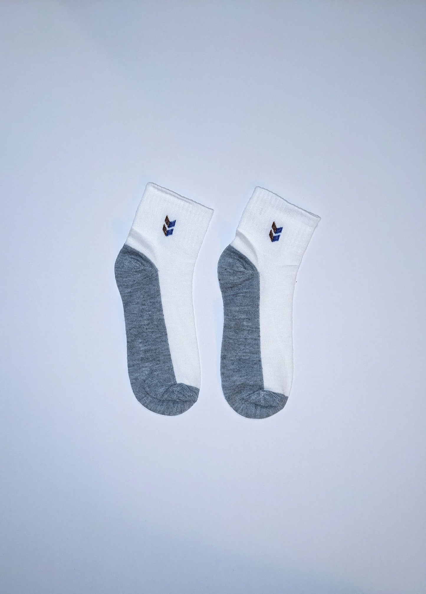 White and gray socks with double chevron accent