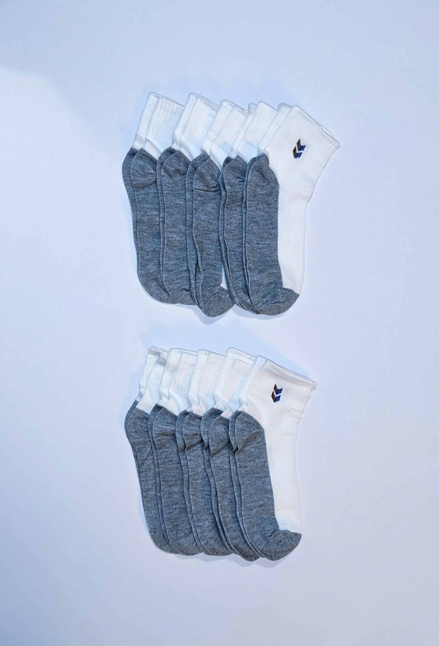 White and gray socks with double chevron accent